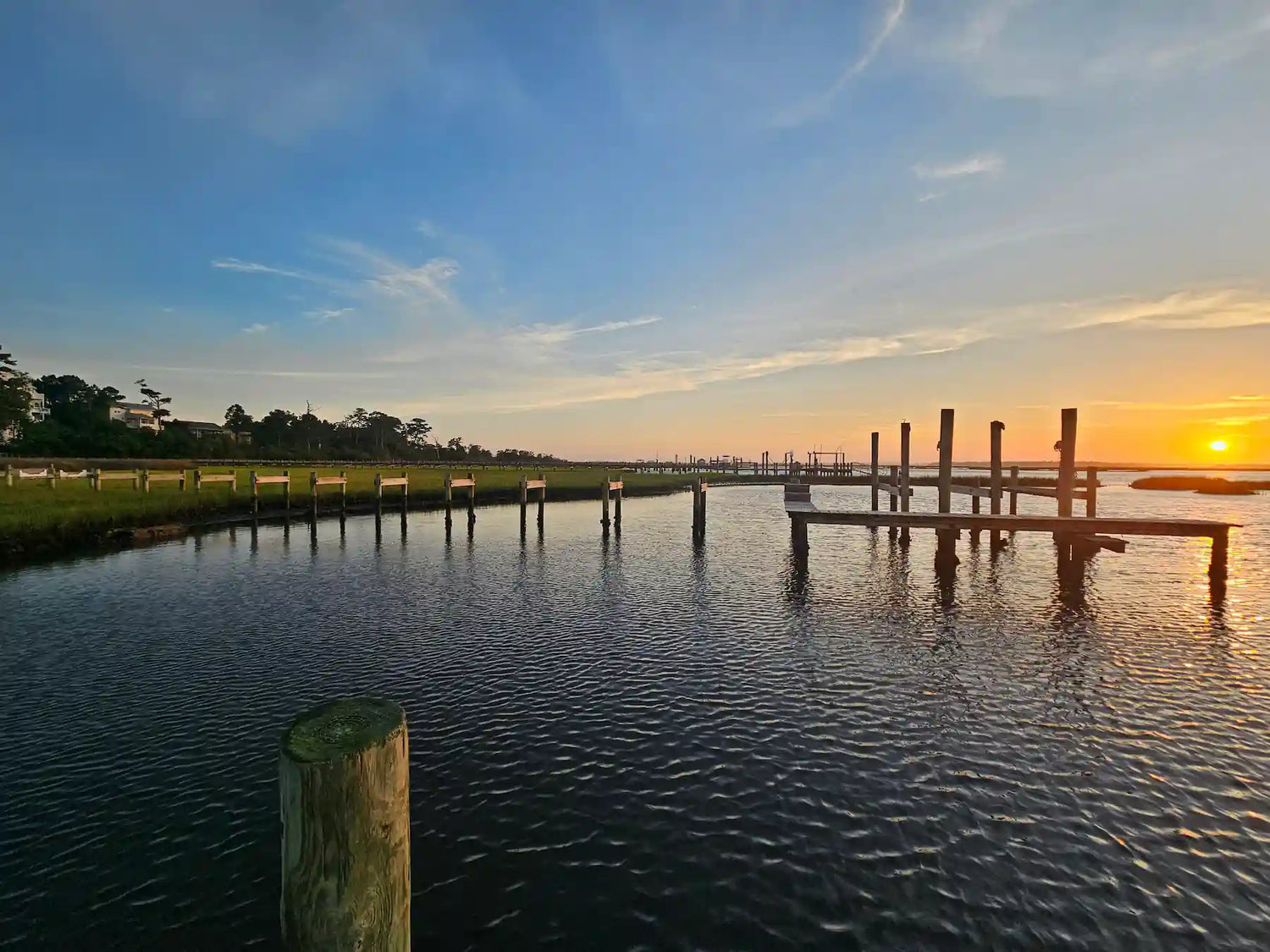 An image of a dock at sunset