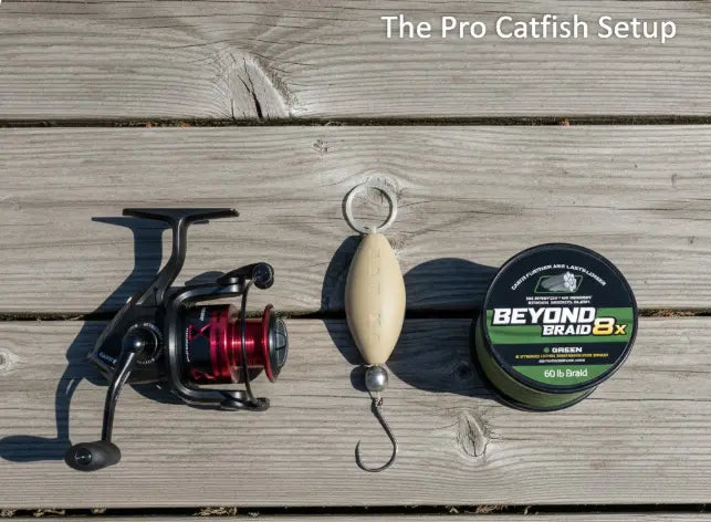 Suspended river catfish drift rig with inline float, steel sinker, and circle hook next to a spool of braided line, and a Penn Fierce spinning reel